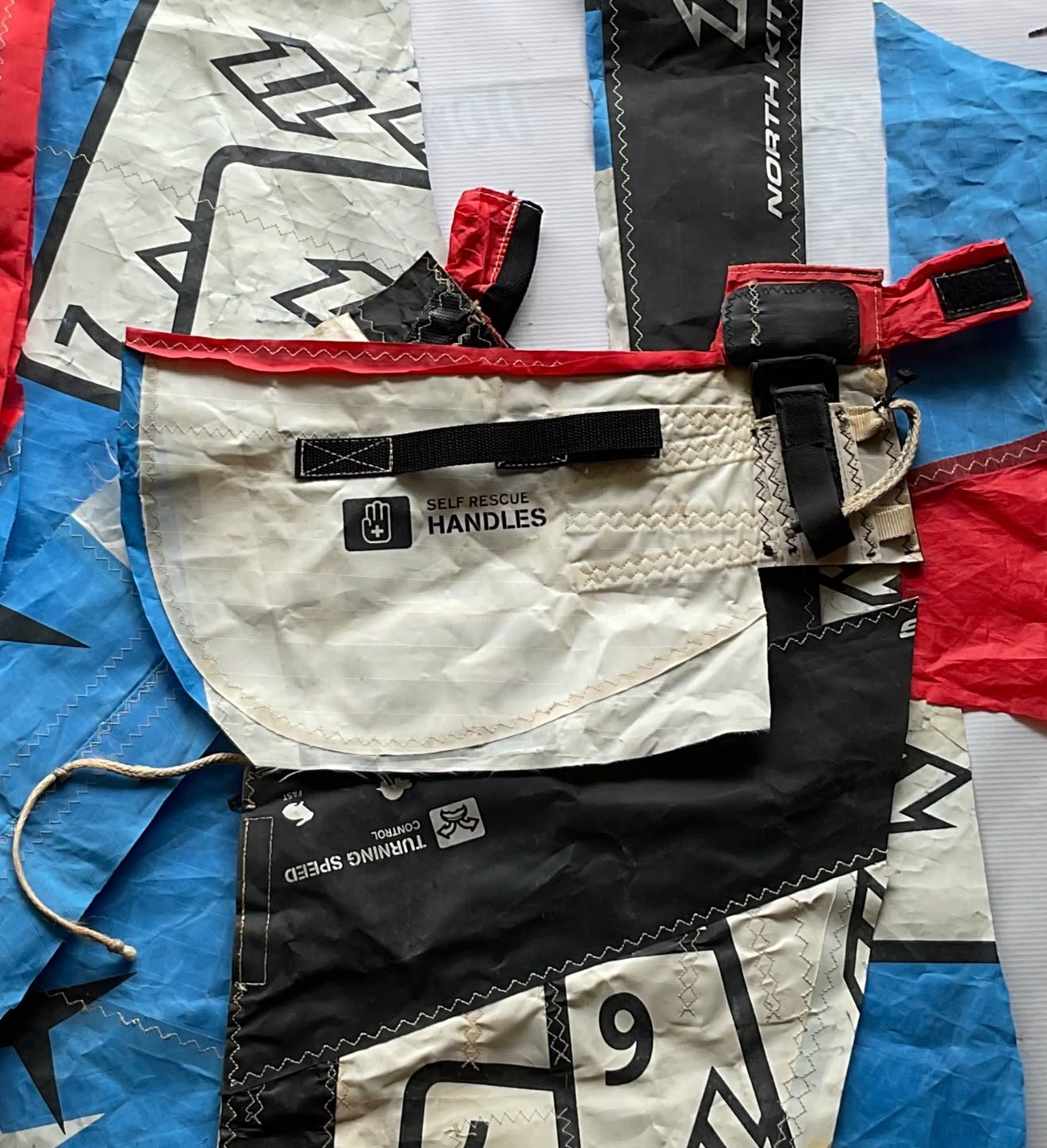 Retired kitesurf sail panels in blue, red, white and black